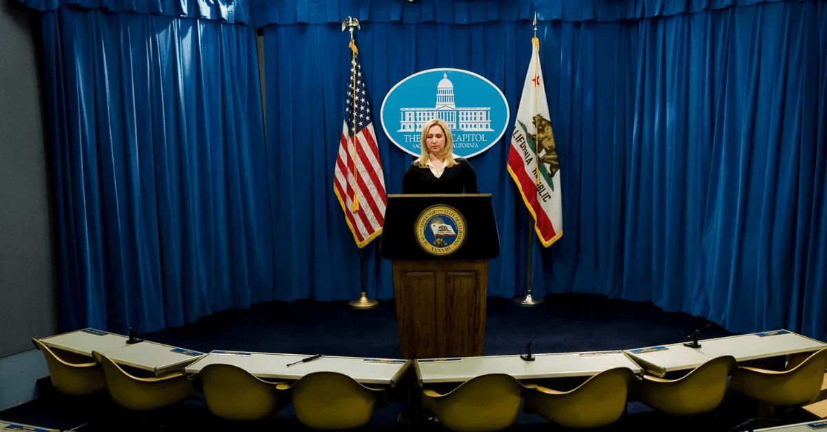 picture of Margita Thompson standing at a podium