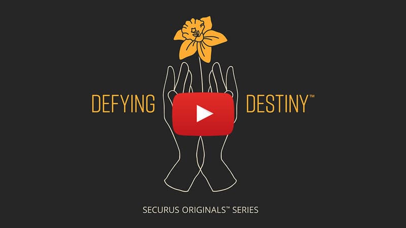 A black background with a stylized figure holding a red play button, accompanied by the text "Defying Destiny" and "Securus Originals' Series".