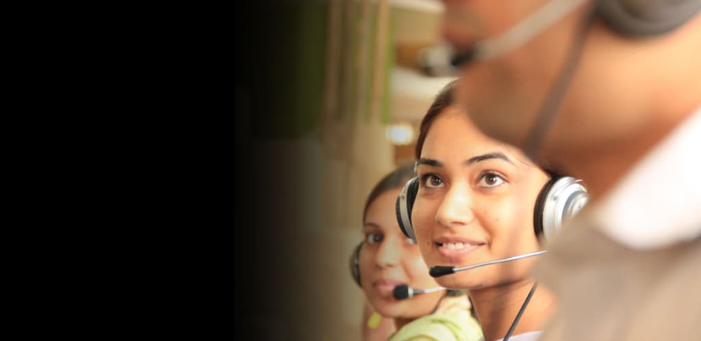 3 Call-center personnel wearing headsets, engaged in customer calls.