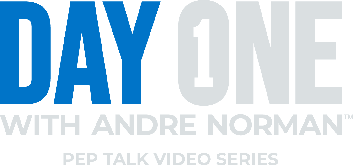 The image displays the text "DAY ONE" in large blue letters, with the text "WITH ANDRE NORMAN" in smaller gray letters below it. The background appears to be a plain white or light-colored surface.